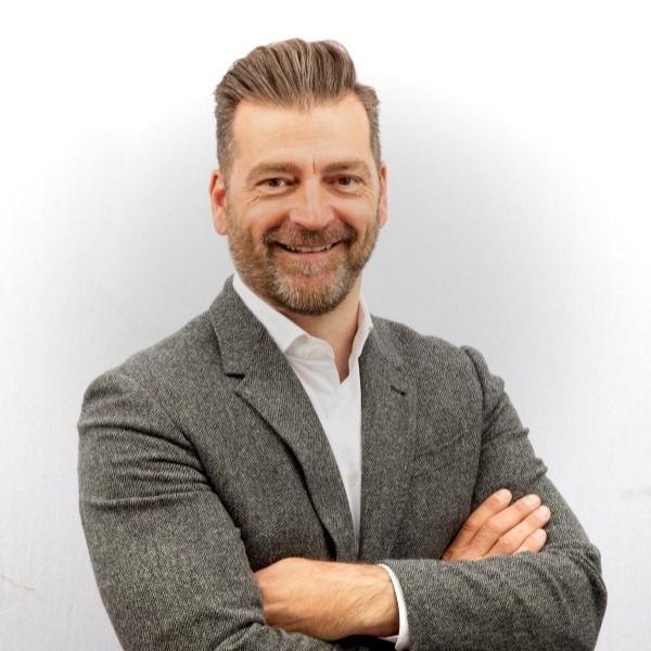 Adam Young, Client Partner at EvolveCX AI